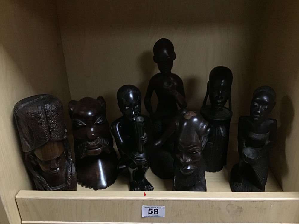 A GROUP OF SEVEN AFRICAN CARVED WOODEN FIGURES, LARGEST 26CM HIGH