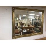 A MODERN LARGE GILDED BEVELLED MIRROR 130 X 102 CMS.