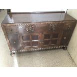 A VINTAGE OAK DRESSER WITH DROP HANDLES 131 X 80 X 50 CMS