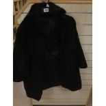 A LADIES ASTRAKHAN COAT IN BLACK WITH FUR COLLAR