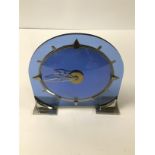 AN ART DECO BLUE GLASS AND CHROME MOUNTED MANTLE CLOCK, MADE IN ENGLAND, 21CM HIGH BY 21CM WIDE