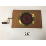 AN EARLY MAHOGANY CASED MAGIC LANTERN KALEIDOSCOPE SLIDE WITH BRASS AND TURNED WOODEN ROTATING