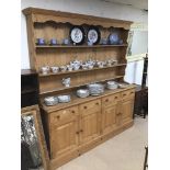 A LARGE PINE KITCHEN DISPLAY UNIT IN TWO PIECES 184 X 200CMS.