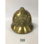 A VINTAGE BRASS FRENCH FIREMAN'S HELMET FROM THE CITY OF ISSOIRE ' SAPEURS POMPIERS D'ISSOIRE'