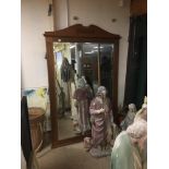 A LARGE OAK FRAMED MIRROR 187CM HIGH BY 125CM WIDE