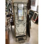 A RETRO BLACK METAL HALL STAND WITH MIRROR.
