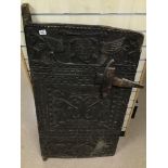 A VERY LARGE ANTIQUE CARVED AFRICAN GRANARY DOOR WITH LARGE WOODEN LATCH FROM THE DOGON TRIBE