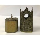 A VICTORIAN BRASS WATCH HOLDER IN THE FORM OF A GOTHIC BUILDING, TOGETHER WITH A BRASS TEA CADDY