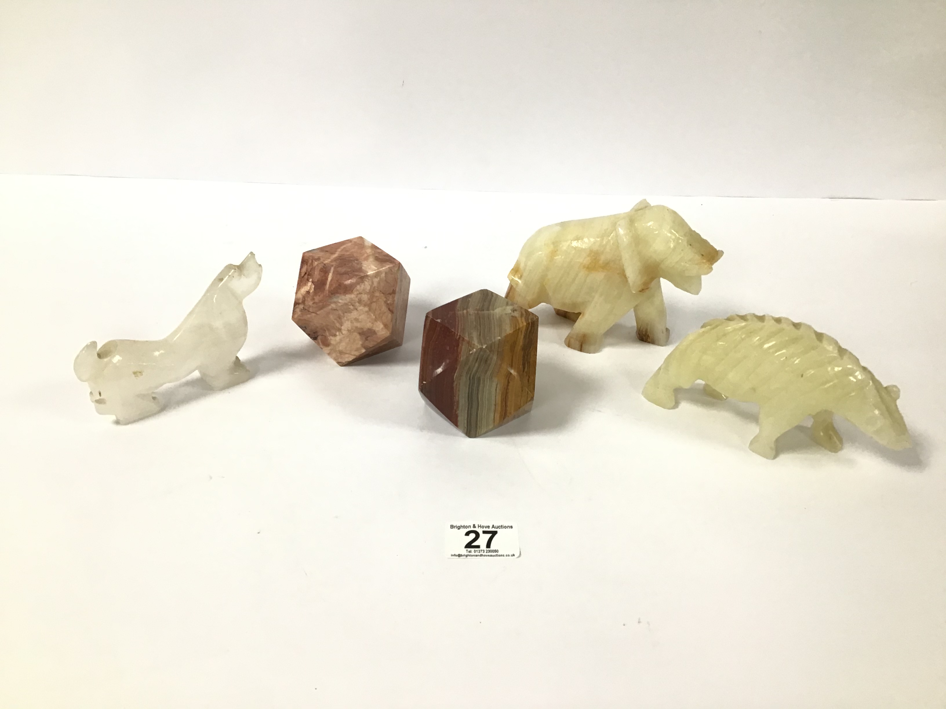 A GROUP OF FIVE CARVED SOAPSTONE ITEMS, INCLUDING THREE ANIMALS AND TWO PAPERWEIGHTS