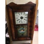 A MAHOGANY CASED AMERICAN WALL CLOCK BY NEWHAVEN CLOCK CO, THE FRONT GLASS PANEL WITH BEEHIVE