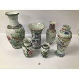 A GROUP OF SIX CHINESE AND JAPANESE PORCELAIN VASES, EACH HIGHLY DECORATED, LARGEST 35CM HIGH (AF)