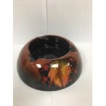 WILLIAM MOORCROFT FLAMBE ASH TRAY OF CIRCULAR FORM WITH LEAF AND BERRY DECORATION MARKED TO THE BASE