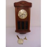 A mahogany cased wall regulator, silvered dial, Arabic numerals, to include key and pendulum