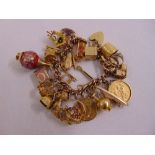 9ct gold bracelet with charms and sovereigns set in pendants, approx total weight 104.2g