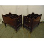 A pair of mahogany magazine racks with original brass castors and swing side handles