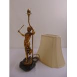 A gilded metal table lamp in the form of a lady holding a violin on hexagonal marble base to include