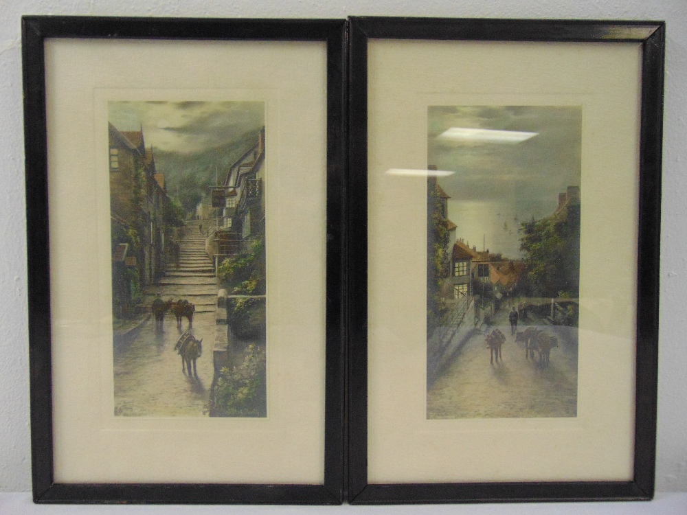 Elmer Keene a pair of framed and glazed coloured etchings of Clovelly High St