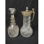 A cut glass decanter with drop stopper and cut glass and silver plated claret jug