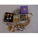 A quantity of costume jewellery to include a Christian Dior bracelet, Monet earrings and other