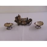 A pair of Chinese white metal bonbon dishes in the form of leaves and a condiment set in the form of