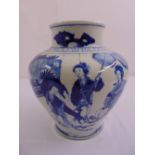 A Chinese blue and white baluster vase decorated with figures in a garden