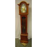 A yew wood long case clock with phases of the moon, glazed sides and hinged door on pedestal base,