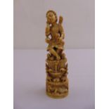 A late 17th/18th century carved ivory Indo-Portuguese Goan figurine of Christ as the good shepherd