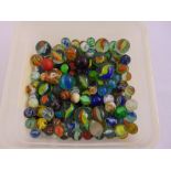 A quantity of antique marbles of various size and colour