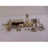 A quantity of silver to include a jewellery casket, a cream jug and a pair of dwarf candle sticks (