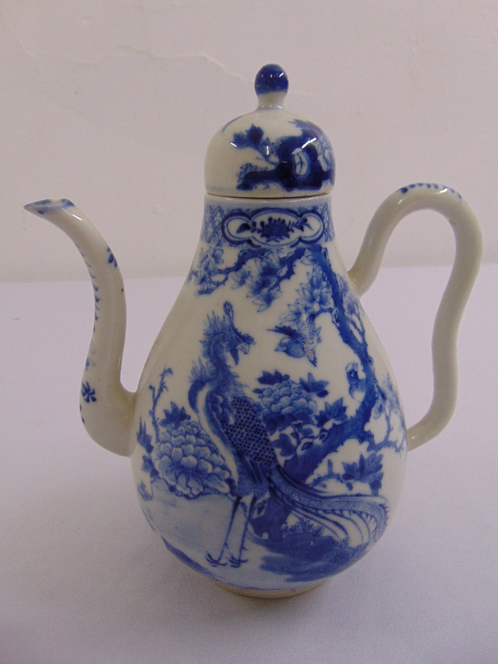 A Chinese blue and white pear shaped teapot, four character marks to the base