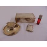 A silver capstan inkwell, a silver cigarette box, a Bryant and May silver vesta case and a ruby