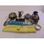 A quantity of silver plate to include flatware, entree dishes and a crumb scoop