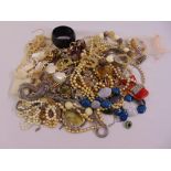 A quantity of costume jewellery to include necklaces, bangles, brooches and watches