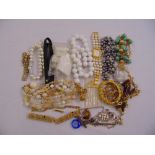 A quantity of costume jewellery to include bracelets, necklaces and a wristwatch