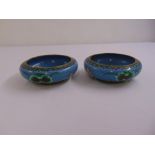 A pair of late 20th century cloisonné bowls decorated with stylised flowers and leaves