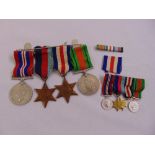 A quantity of WWII medals to include 1939-45 star, France and Germany star and miniatures