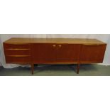 Macintosh rectangular teak sideboard, three drawers and cupboards on four tapering cylindrical legs