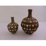 Two Moorish style metal and bone globular liquid containers