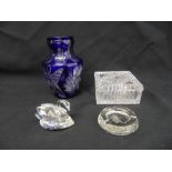 A Bohemian style overlaid blue glass vase, a cut glass covered box, an ashtray and a Swarovski style