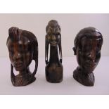 Three carved Madagascan ebony female heads