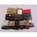 A quantity of sunglasses, wallets and card cases to include Versace, Cartier, Gucci