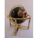 A lapis gem stone globe in gilded metal stand to include original packaging