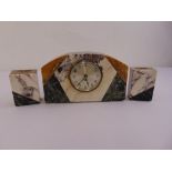 An Art Deco style marble clock set, silvered dial, Arabic numerals