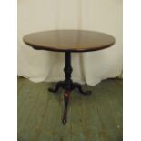 A Victorian mahogany circular tilt-top occasional table on three outswept legs
