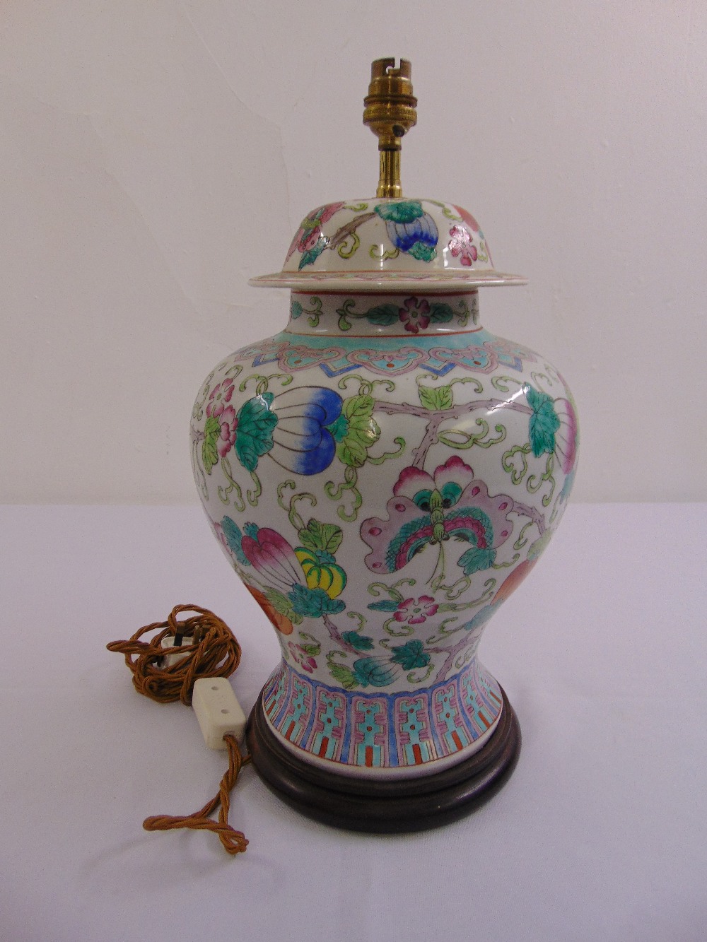 A Chinese porcelain baluster vase decorated with flowers and butterflies, later converted to a table