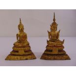 Two 19th century oriental gilded figurines of Buddha on stepped rectangular bases