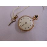 9ct gold pocket watch with enamel dial and Roman numerals, to include key