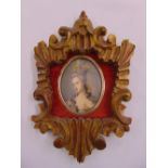 A framed miniature of a lady in 18th century attire
