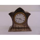 A silver mounted desk clock of rectangular form engine turned, white enamel dial, Roman numerals