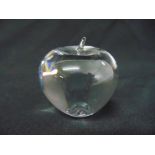 A Tiffany paperweight in the form of a glass apple